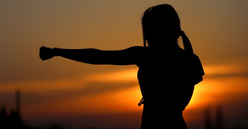 women fighter in sunset