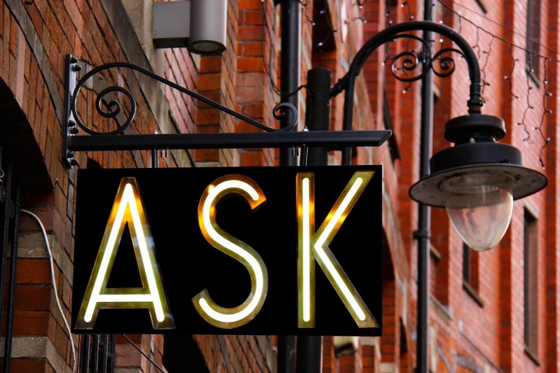 street sign with the word "Ask"