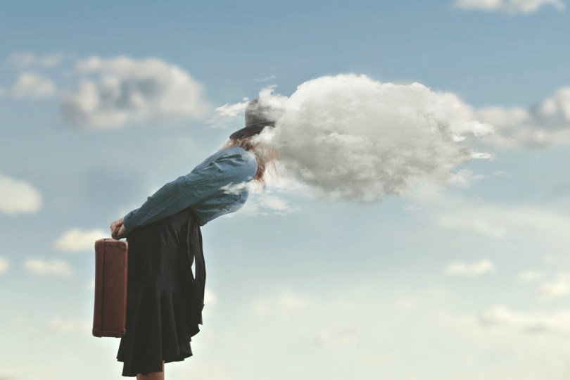 woman with her head (literally) in the clouds